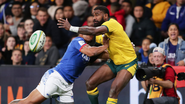 Marika Koroibete gets an offload away before going into touch.