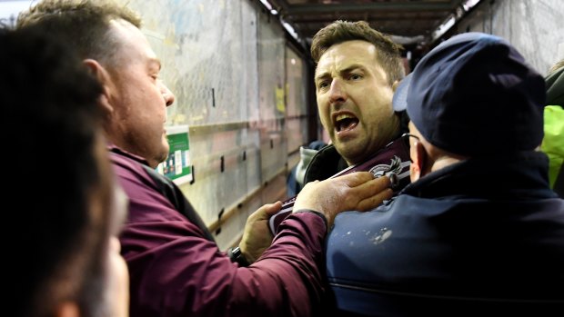Alarming breach: Security and police swooped on a Manly fan, centre, who confronted Melbourne Storm’s Will Chambers on Saturday night at Lottoland.