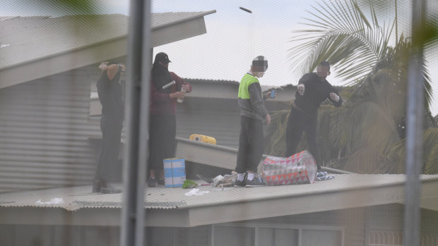 Inmates are seen on the roof of Frank Baxter Juvenile Justice Centre at Kariong  during the riot.