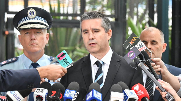 NSW Police Assistant Commissioner Scott Cook (centre) with Commissioner Mick Fuller (left) in 2018.