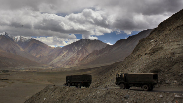 Indian army trucks drive near Pangong Tso lake near the India-China border in India's Ladakh area in 2017. 