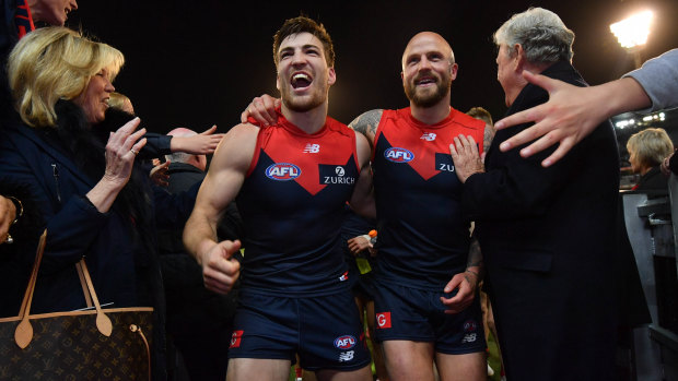 Winners are grinners: Jack Viney and Nathan Jones leave the field.