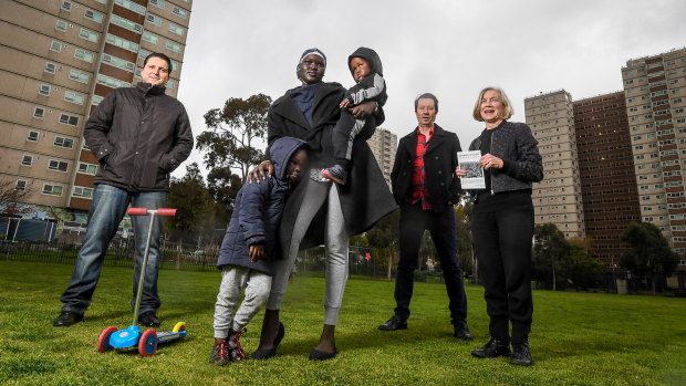 (From left) Atherton Gardens residents Ranko Cosic and Jenny Nyibol and her children, with City of Yarra councillor Stephen Jolly and residents association member Margaret O'Brien.