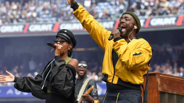 Will.i.am (right) and Jessica Reynoso before Saturday's AFL Grand Final.