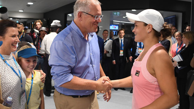 On the boos: Scott Morrison meets Ash Barty at the Australian Open.