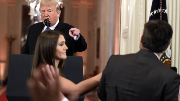 A White House intern attempted to grab the microphone off Jim Acosta.