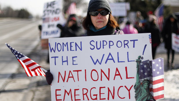 Supporters of the border wall at a women for Trump  rally in  Michigan on Saturday.