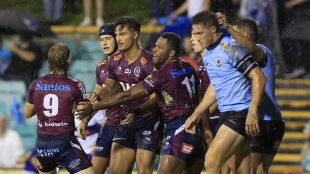 Jordan Petaia celebrates a try for the Reds against NSW at Leichhardt Oval in round two.