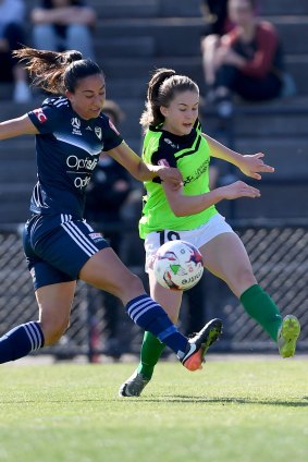 Melbourne Victory's Gulcan Koca and Canberra's Aoife Colvill battle for the ball.