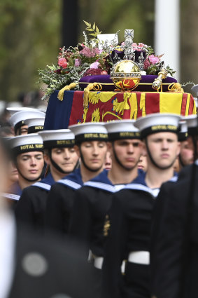 Royal Navy Sailors walk ahead and behind the coffin of Queen Elizabeth II