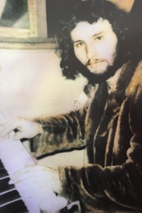 Tim, aged 21, at his piano.