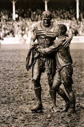 Norm Provan ( St George) and Arthur Summons (Wests) leave a muddy SCG after the 1963 Rugby League Grand Final.