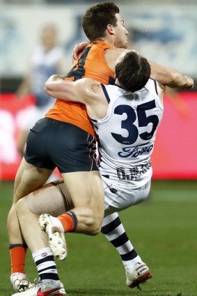 The fend-off in question: Toby Greene’s on Patrick Dangerfield.