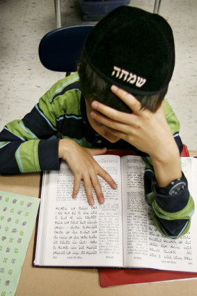 A boy studies Yiddish at a Hasidic school in Chicago in 2006. 