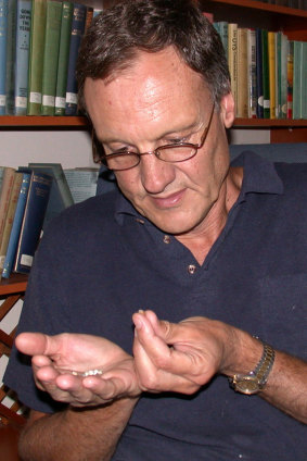 Chris Henshilwood examines tiny shell beads found in the Blombos cave.