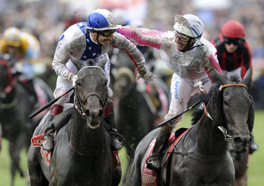 Gerald Mosse is congratulated by Luke Nolen after winning the Melbourne Cup on Americain in 2010.