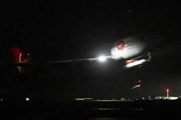 Cosmic Girl, the 747 aircraft carrying the LauncherOne rocket under its left wing, takes off from Cornwall Airport.