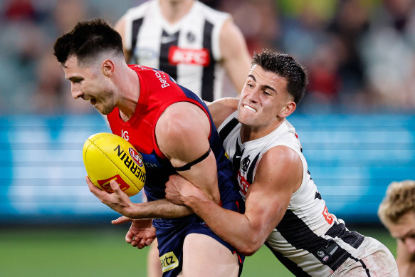 Collingwood’s Nick Daicos tackles Melbourne’s Alex Neal-Bullen. Daicos finished the game with 40 disposals.