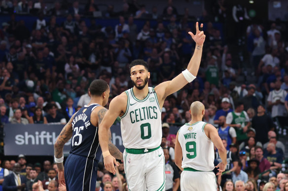 Jayson Tatum #0 of the Boston Celtics celebrates after making a shot.