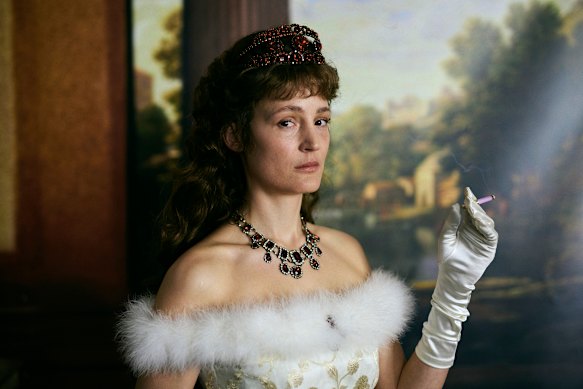 Vicky Krieps gives a stunning performance as Sisi, the rebellious wife of Emperor Franz Joseph of Austria, in Corsage.