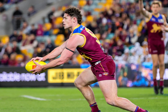 Lachie Neale gets a kick away against Gold Coast.