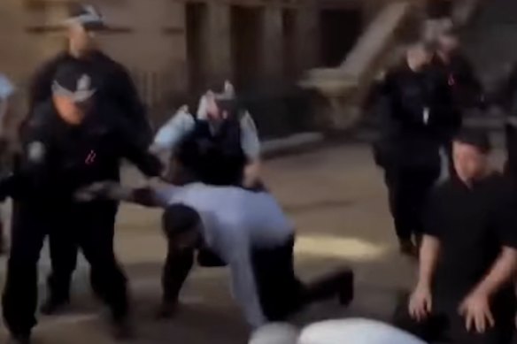 Videos show police removing people who were praying outside Sydney Town Hall on February 9.