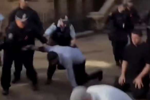 Videos showed police removing people who were praying outside Sydney Town Hall on February 9.