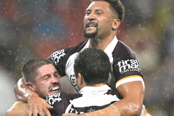Brisbane Broncos celebrate against the Dolphins.