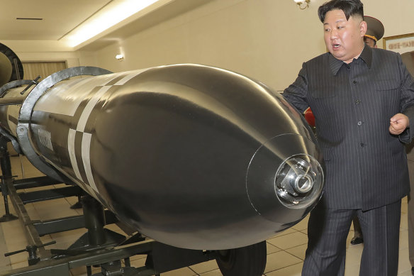 North Korean leader Kim Jong-un visits a hall displayed what appeared to be various types of warheads designed to be mounted on missiles or rocket launchers in undisclosed location, North Korea.