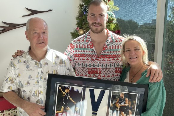 Harry McKay with his father Peter and mother Tracey, who he has given his 2021 Coleman Medal.