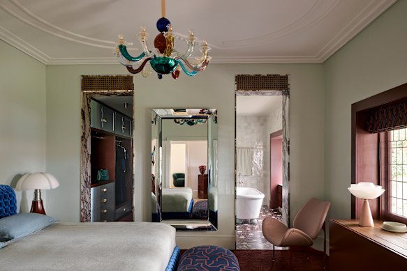 Interior designer Greg Natale used burgundy liberally in this project in Sydney, including tiles, carpet and joinery.