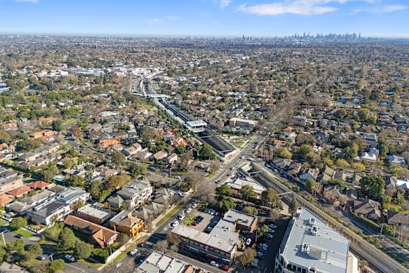 Aerial shot. 343-369 Mont Albert Road, is at the intersection of the road and the railway line.