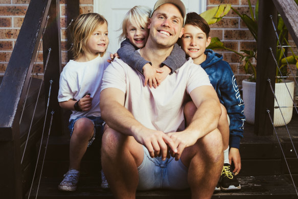 Matt Grant with his children Archie, 9, Harry, 6, and Jack, 3, at their home in Collaroy, Sydney.