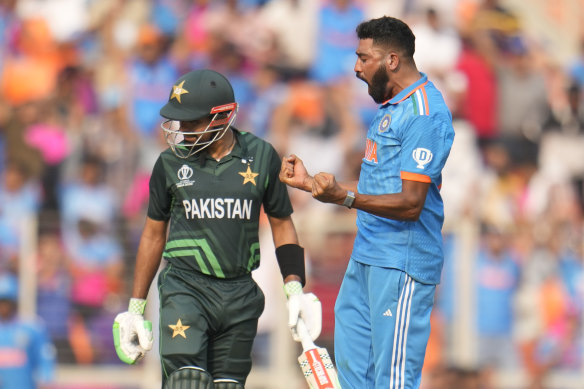 India’s Mohammed Siraj celebrates the wicket of Pakistan’s captain Babar Azam (left).