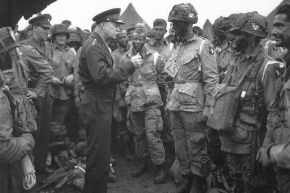 US Army General Dwight D. Eisenhower, who directed the invasion, gives the order of “Full victory, nothing else” to paratroopers in England on June 6, 1944, just before they boarded their planes for the first assault.