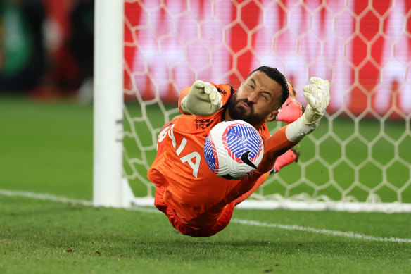 Melbourne Victory goalkeeper Paul Izzo saves a penalty from Terry Antonis of Melbourne City during their elimination final.