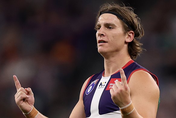 Dockers star Caleb Serong celebrates a goal.