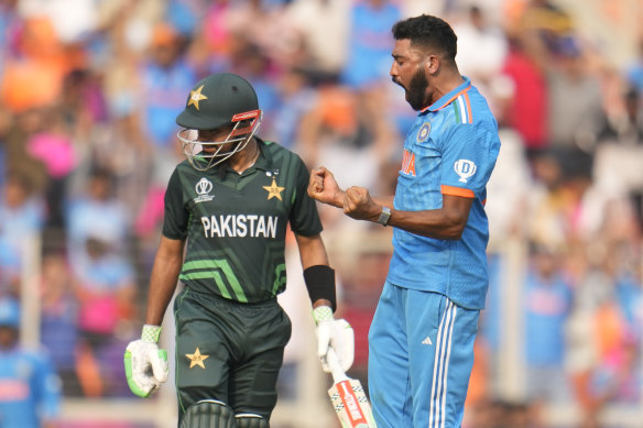 India’s Mohammed Siraj celebrates the wicket of Pakistan’s captain Babar Azam (left).