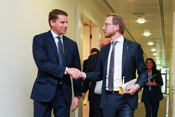 Andrew Hastie and James Paterson shake hands after the meeting.