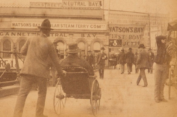 Arthur Syer captured the bustling streets of late 19th-century Circular Quay. This photograph is taken near First Fleet Park.