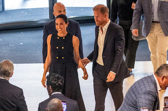 Harry and Meghan are welcomed by fans waiting at The Royal Children’s Hospital in Melbourne.