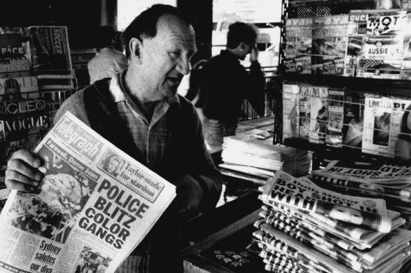 Newsagent Billy Bryan sells papers, including the Daily Mirror, at Circular Quay on October 3, 1990. 