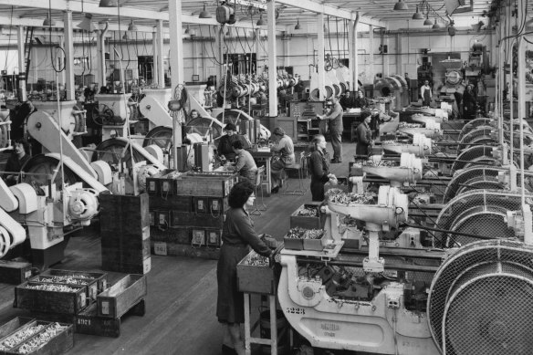 Workers on the factory floor: a small arms ammunition factory in Melbourne in 1969.