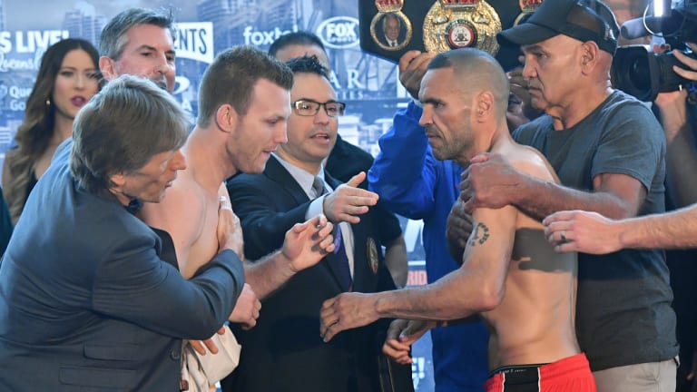 Strange scenes: Horn and Mundine are separated at the weigh-in.