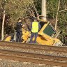 The front-end loader crashed through a rail corridor in Ipswich, south-west of Brisbane, damaging rail infrastructure.