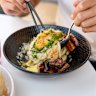 Udon carbonara with charred kaiserfleisch, a soft egg and pepper. 
