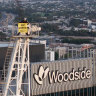 Greenpeace activists scale crane to protest Woodside gas expansion plans