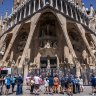 Tourists visit the Sagrada Familia church in Barcelona.