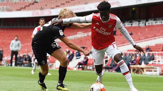 Arsenal's Bukayo Saka takes on Charlton's George Lapslie during the Gunners' 6-0 practice match win.