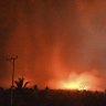 The sky glows from the eruption of Mount Lewotobi Laki-Laki on Monday.